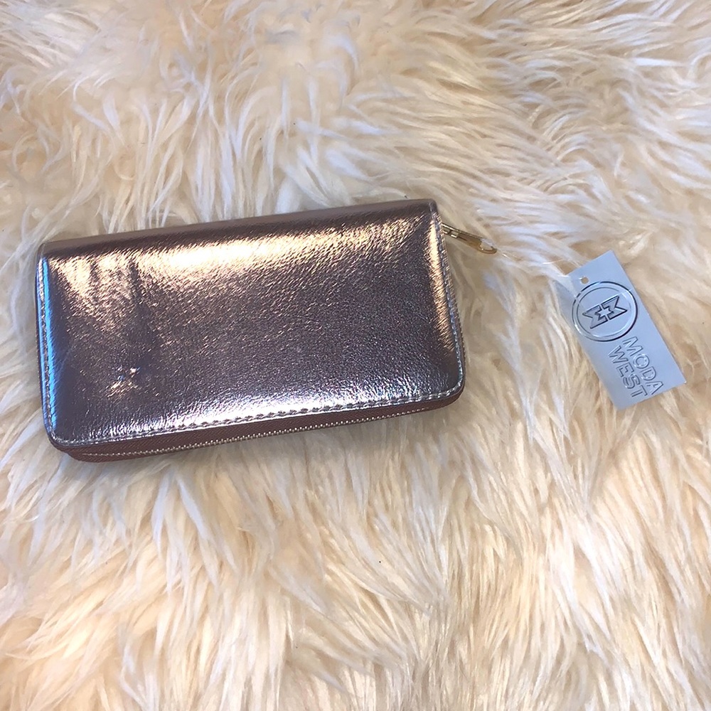 Pewter clutch or wallet for stashing cash cards or cell phone.